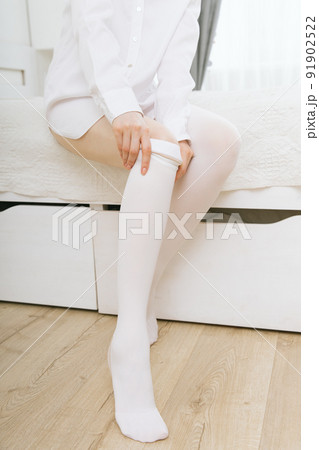 Anti-embolic Compression Hosiery for surgery isolated on white. Medical white stockings, tights for varicose veins and venouse therapy. Thrombo embolic deterrent hose or anti-embolism stockings. Anti-embolic Compression Hosiery for surgery isolated on white. Medical white stockings, tights for varicose veins and venouse therapy. Thrombo embolic deterrent hose or anti-embolism stockings. 91902522