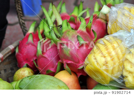 Basket full with exotic fruits in a market. Vietnam 91902714