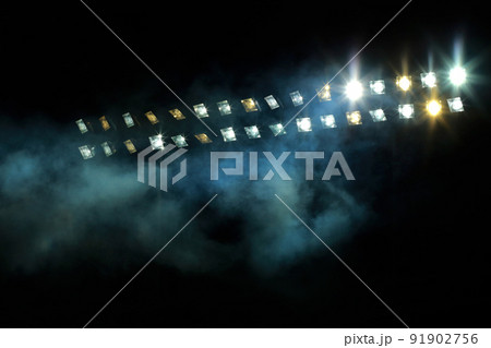 Stadium lights against dark night sky Stadium lights against dark night sky 91902756