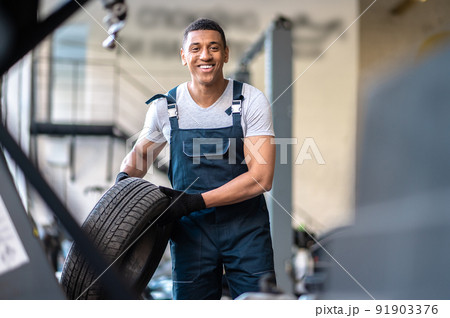 Service station worker posing for the camera at work 91903376