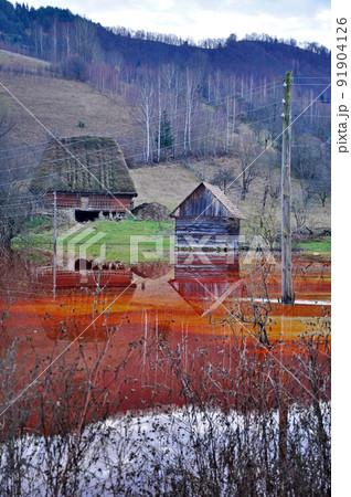 An abandoned house flooded by polluted water An abandoned house flooded by polluted water 91904126