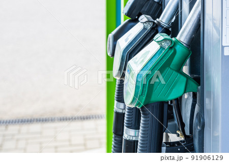 Close up of diesel and petrol fuel filling pistols at a gas station 91906129