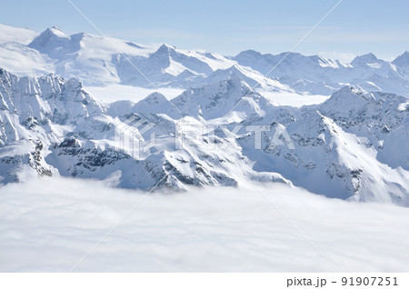 Alpine snow covered peak in the Alps at winter 91907251