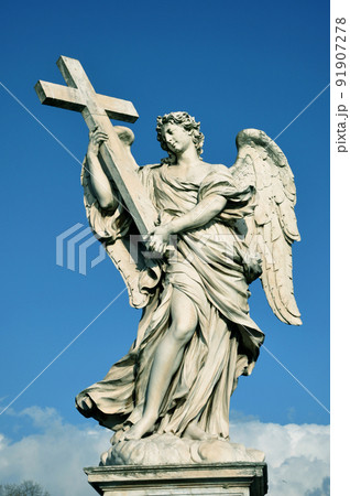 Statue of angel with holy cross Statue of angel with holy cross 91907278