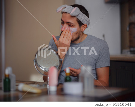 Men's beauty concept. caucAsian guy checking his skin. Men's beauty concept. caucAsian guy checking his skin. 91910041