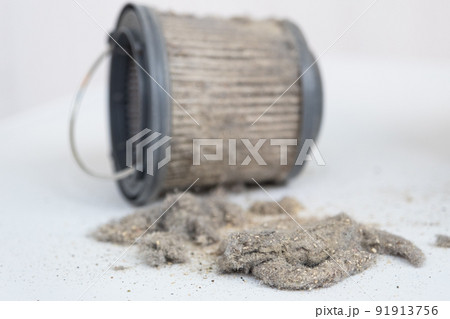 Dirty vacuum cleaner filter. The miniature vacuum cleaner has collected a lot of dust and debris Dirty vacuum cleaner filter. The miniature vacuum cleaner has collected a lot of dust and debris 91913756