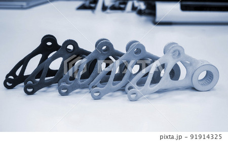 Models printed on 3D printer isolated on white background. Objects details printed on 3D printer from plastic close-up. Prototypes of shapes made by 3d printer. Concept new modern printing technology 91914325