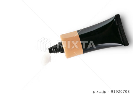 A tube of face cream lies on the table isolated. 91920708