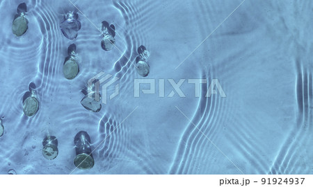 Abstract cosmetic water background for spa and moisturizing medical cosmetics. Blue water texture, blue water surface with rings and ripples. Spa concept background. 91924937