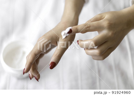 Beautiful groomed woman's hands with cream jar on the blanket. Moisturizing cream for clean and soft skin. Healthcare concept. Beautiful groomed woman's hands with cream jar on the blanket. Moisturizing cream for clean and soft skin. Healthcare concept. 91924960