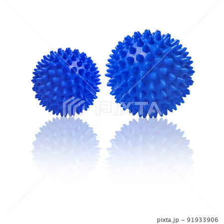 Two blue spiny massage balls isolated on white. Concept of physiotherapy or fitness. Closeup of a colorful rubber ball for dog teeth on a white color background. Corona virus model. Snowflake. Two blue spiny massage balls isolated on white. Concept of physiotherapy or fitness. Closeup of a colorful rubber ball for dog teeth on a white color background. Corona virus model. Snowflake. 91933906