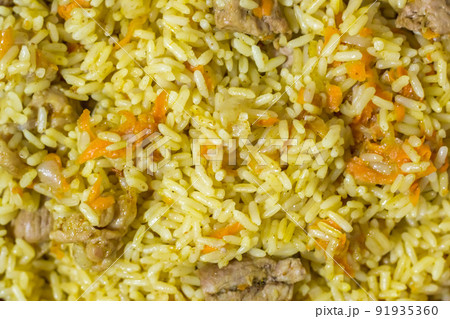 Pilaf with beef, carrots, onions, garlic, pepper and cumin. A traditional dish of Asian cuisine. 91935360