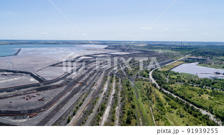 Tailing dump in industrial city aerial view Tailing dump in industrial city aerial view 91939255