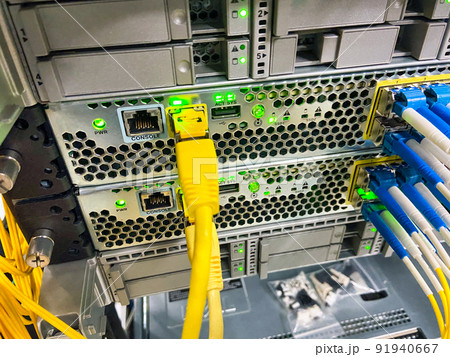 Network equipment with green lights working in a data center 91940667