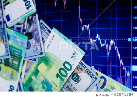 dollar and euro banknotes over digital screen with exchange chart, USD EUR parity concept 91941284