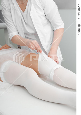 Anti-embolic Compression Hosiery for surgery isolated on white. Medical white stockings, tights for varicose veins and venouse therapy. Thrombo embolic deterrent hose or anti-embolism stockings. Anti-embolic Compression Hosiery for surgery isolated on white. Medical white stockings, tights for varicose veins and venouse therapy. Thrombo embolic deterrent hose or anti-embolism stockings. 91943027