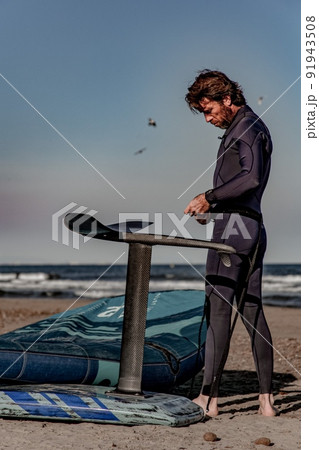 wing foil old kiter on the beach 91943508