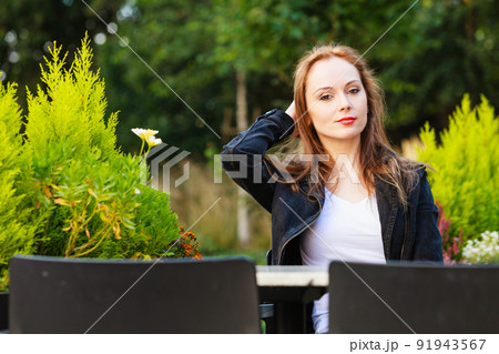 Woman waiting in outdoor restaurant cafe. Woman waiting in outdoor restaurant cafe. 91943567