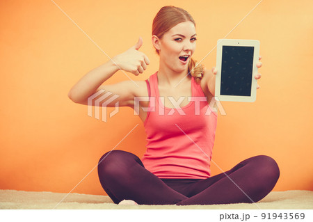 Sporty girl with pc tablet. Blank screen copyspace Sporty girl with pc tablet. Blank screen copyspace 91943569