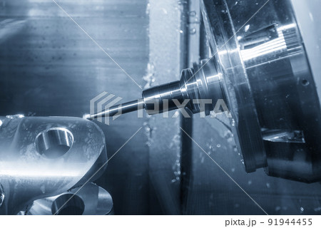 The multi-tasking CNC machine milling the automotive transmission part. The multi-tasking CNC machine milling the automotive transmission part. 91944455