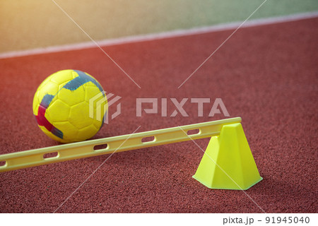 Soccer training equipment on green artificial turf. Material for trainning class of football academy. 91945040