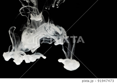 selective focus white liquid drop in clear water with lighting, look like smoke in the night. 91947473