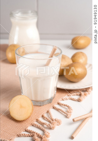 A glass of potato milk on the table. Alternative Plant-Based Milk A glass of potato milk on the table. Alternative Plant-Based Milk 91949130