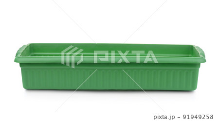 Front view of empty green plastic seedling tray 91949258