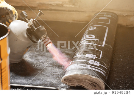 installation of waterproofing coating on the floor with a blowtorch and resin. 91949284