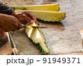 Closeup on  cutting pineapple 91949371