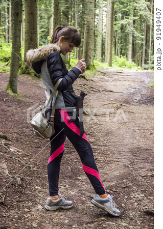a girl feeding a carpathian squirell in the forest, Skole Beskids National Nature Park, Ukraine 91949407