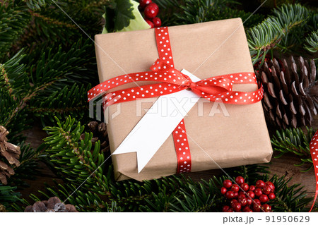 Christmas rectangle strip gift tag mockup with present box, product label mockup, with natural fir tree branch, name tag Christmas rectangle strip gift tag mockup with present box, product label mockup, with natural fir tree branch, name tag 91950629
