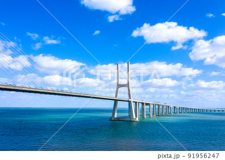 Famous Vasco da Gama Bridge over River Tejo in Lisbon from above 91956247