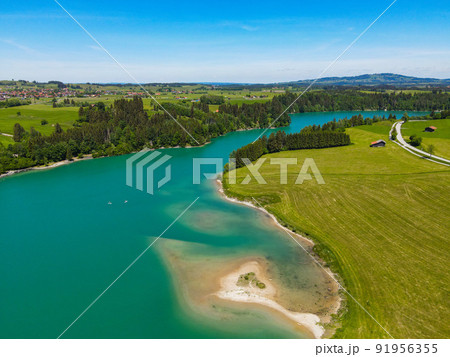 Aerial view over Lake Forggensee at the city of Fuessen in Germany Aerial view over Lake Forggensee at the city of Fuessen in Germany 91956355
