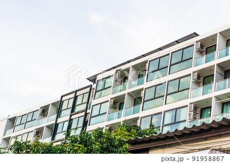Modern real estate condominium building with blue window Modern real estate condominium building with blue window 91958867