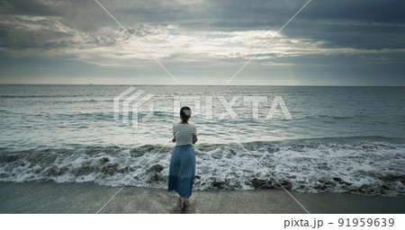 woman walking at beach woman walking at beach 91959639
