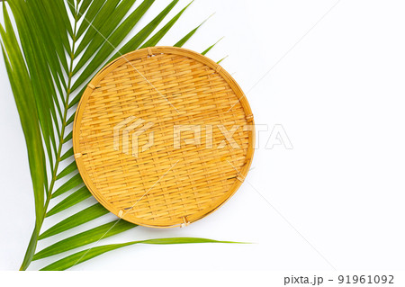 Bamboo weave plate on green leaves. Copy space Bamboo weave plate on green leaves. Copy space 91961092