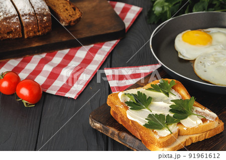 Simple breakfast. Toasted bread covered with butter Simple breakfast. Toasted bread covered with butter 91961612