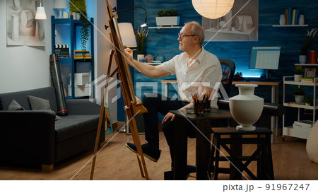 Old person with creative skills drawing vase design for hobby with art and craft equipment. Using artistic tools to draw professional artwork sketch in authentic workshop, design inspiration. 91967247