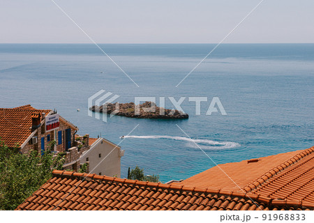 Sveti Stefan is a small island on Adriatic coast of Montenegro near of Budva. Resort is known commercially as Aman Sveti Stefan. Sveti Stefan peninsula on the Adriatic Sea in Budva, Montenegro, Europe 91968833