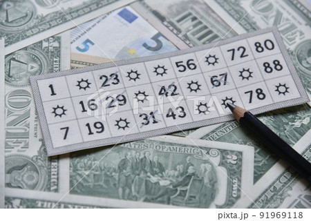 Dollar bills and lottery tickets with a pencil Dollar bills and lottery tickets with a pencil 91969118