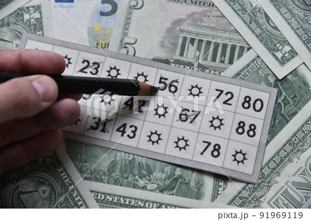 Dollar bills and lottery tickets with a pencil Dollar bills and lottery tickets with a pencil 91969119