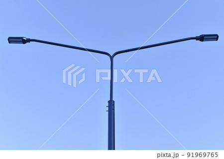 Double street traffic light in the daytime against the sky 91969765