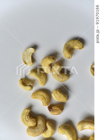 White cashew nuts in a group scattered on a white background 91970166