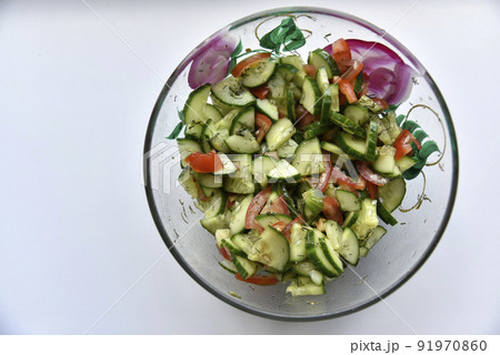 Cucumber and tomato salad with dill in a plate 91970860