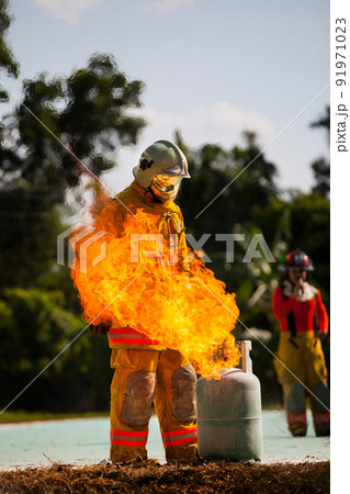 Firefighter with fire and suit for protect fire fighter for training firefighters. 91971023