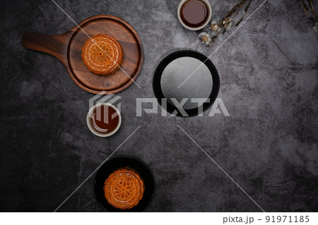 Tasty moon cakes for Mid Autumn festival or Chinese traditional festival on dark stone background 91971185