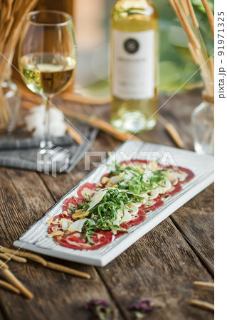 Portion of gourmet beef carpaccio appetizer 91971325