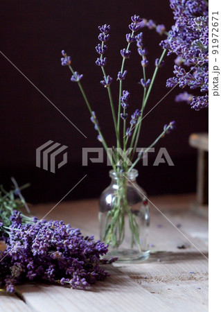 Lavender flowers on wooden background Lavender flowers on wooden background 91972671