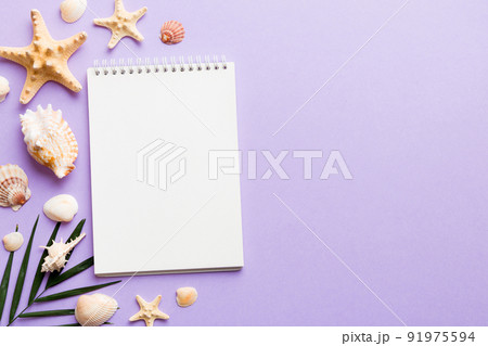 Blank writing book with summer beach accessories on background, copy space. Flat lay with copy space 91975594